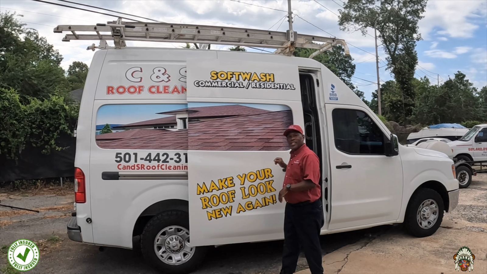 Charles Shelton, owner of C & S Roof Cleaning, in front of his soft wash van in Little Rock AR