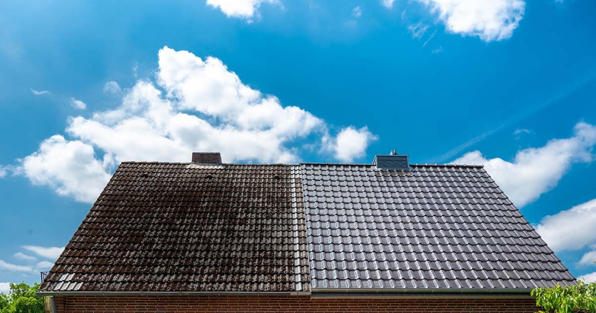 Roof shown half cleaned, stained shingles beside clean shingles, after a soft wash in Little Rock AR