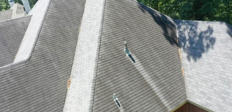 Before: Roof ridge line with algae staining cleaned by soft wash in central Arkansas