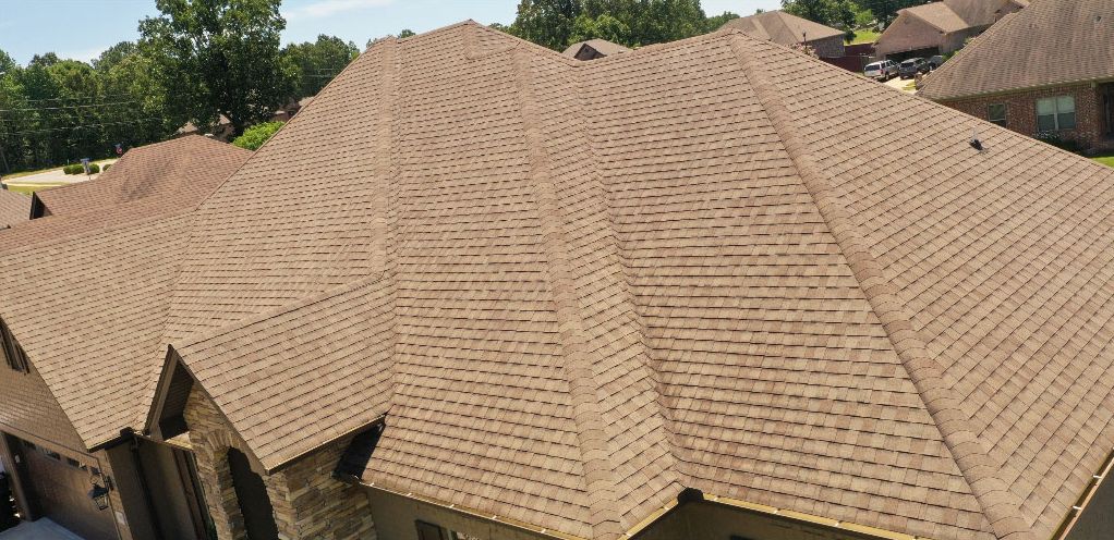 Clean tan shingle roof after algae removal in central Arkansas