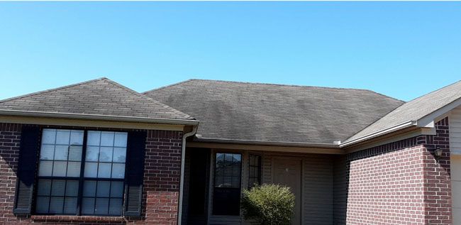 Before: Brick ranch home with black roof streaks removed in central Arkansas