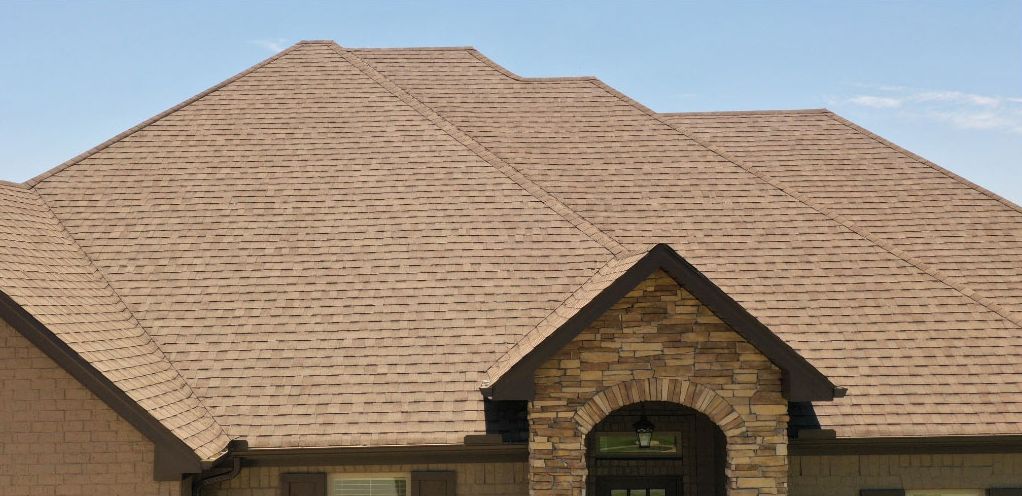 After: brown shingle roof on a Little Rock AR home, soft washed clean by C & S Roof Cleaning