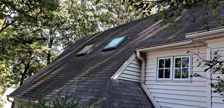 After: Roof with skylights and heavy mildew after mildew removal in the Little Rock area