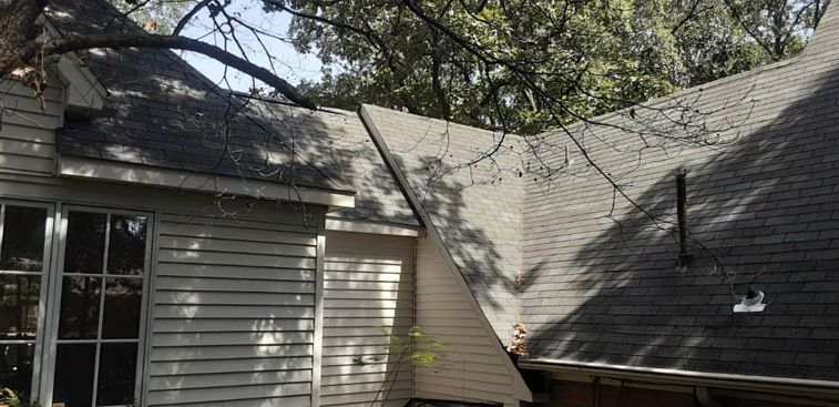 After: Steep dormer roof with moss and algae removed by roof cleaning in the Little Rock AR area
