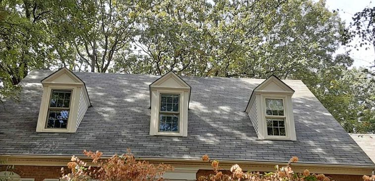 After: Three-dormer roof with mildew stains soft washed clean in the Little Rock area